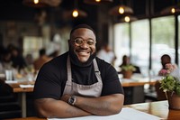 Chubby black male chef restaurant smiling waiter.