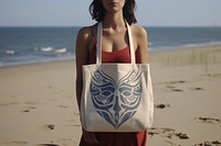 Woman has a tote bag portrait handbag beach. AI generated Image by rawpixel.