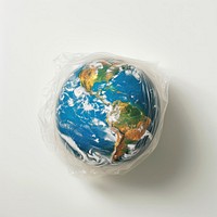 Plastic wrapping over a globe sphere planet space.