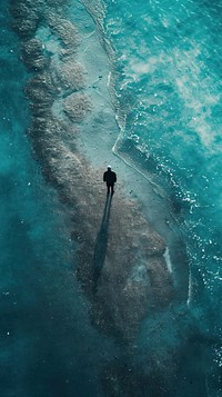 Aerial top down view of Space man walking on mar swimming outdoors nature.