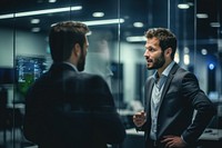Man talking in front coworker adult businesswear conversation. AI generated Image by rawpixel.