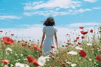 Photo of woman in flower field outdoors standing nature.