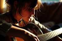 Girl enjoy playing the guitar musician entertainment performance. AI generated Image by rawpixel.