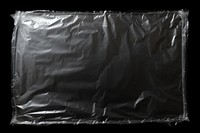 Plastic wrap with hole black black background monochrome.