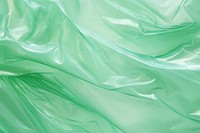 Backgrounds plastic green silk.