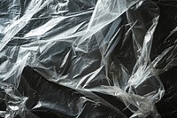 Sheeting of various sizes plastic wrap backgrounds abstract black.
