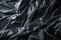Stretch film plastic wrap black backgrounds monochrome.
