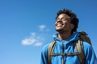 African young man hiking backpack portrait outdoors.