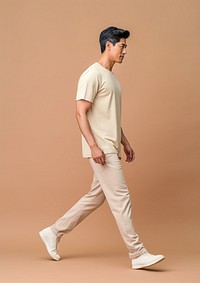 East Asian standing t-shirt walking.