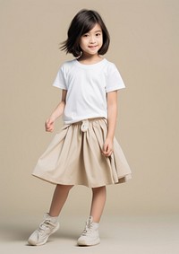 Cream t-shirt and skirt  person child human.