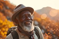 African senior man hiking mountain portrait autumn.