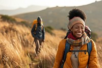 African young couple hiking backpacking recreation adventure.
