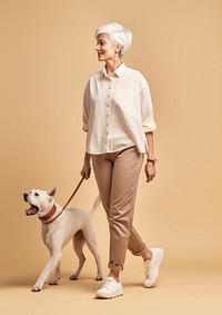 Cream shirt and pant  walking dog animal.