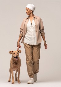 Cream shirt and pant  walking dog mammal.