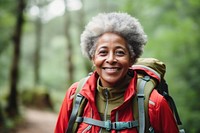 African Senior woman With Backpack portrait backpack forest.