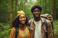 African young couple With Backpack portrait forest outdoors.