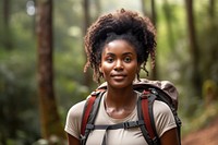African young woman With Backpack portrait forest smile.