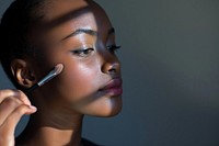 Black South African woman cosmetics makeup perfection.