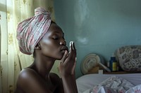 Kenyan woman bedroom adult contemplation.
