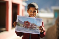 Peruvian young primary school student wearing uniform portrait holding smile.