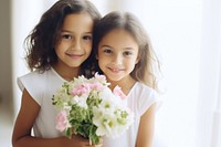 Children holding flowers portrait plant cute. AI generated Image by rawpixel.
