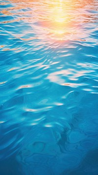 Ocean blue water surface with bright sun light reflections swimming backgrounds abstract.