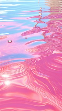 Pink candy water surface with bright sun light reflections backgrounds abstract outdoors.