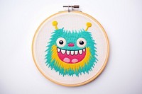 Cute monster in embroidery style textile pattern anthropomorphic.