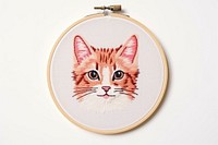 Kitten in embroidery style pattern textile mammal.