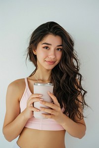 American woman in soft pink top exercise portrait holding smile.