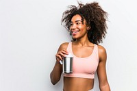 American woman in soft pink top exercise holding white background refreshment.