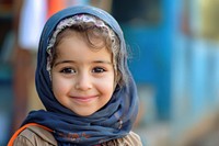 Middle eastern girl portrait scarf smile.