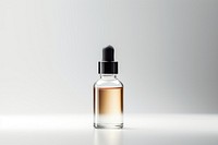 Serum glass bottle cosmetics perfume white background.
