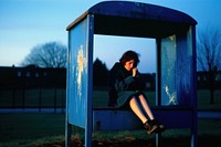 Girl outdoors sitting blue.