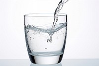 Pouring water into water glass transparent drink refreshment. AI generated Image by rawpixel.