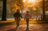 A little boy and girl running walking autumn child. AI generated Image by rawpixel.