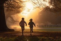 A little boy and girl running morning togetherness backlighting. AI generated Image by rawpixel.