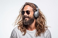 A long hair man with beard headphones sunglasses listening.