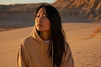 Minimalist hoodie portrait outdoors desert.