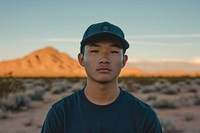 Minimalist cap portrait outdoors desert.