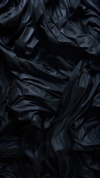  Black crumpled paper backgrounds monochrome abstract. AI generated Image by rawpixel.