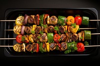 Grilled vegetable and meat skewers grilling grilled food.