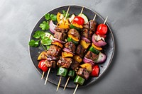 Kebabs grilled meat and vegetables plate food arrosticini.