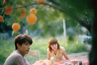 A couple in the garden picnic togetherness friendship furniture. AI generated Image by rawpixel.