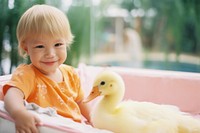 Babies duck with a kid happily photography portrait animal. 