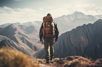 Man hiking on mountain with backpack backpacking adult mountaineering.
