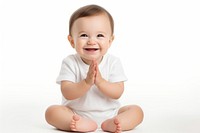 Cute happy white baby sitting and clapping hands portrait white background cross-legged.