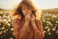 Young woman blowing her nose outdoors photo contemplation photography. AI generated Image by rawpixel.