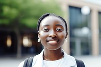 African female student portrait standing smile.