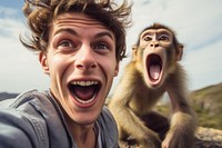 A man and monkey animal wildlife shouting.